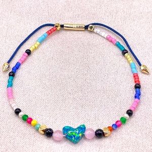 Kendra Scott “Nova” multi stone friendship bracelet w/ blue Kyocera opal heart